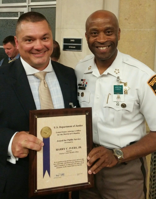 Charles County Sgt. Harry Ivers and Sheriff Troy D. Berry.