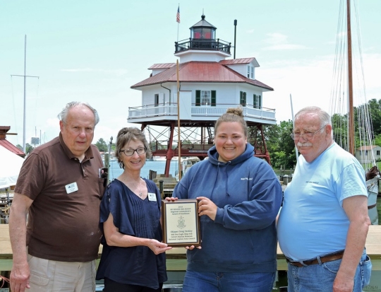 Sea Scouts present Award of Excellence plaque to CMM. Pictured l to r is Ed Gies, Charter Representative; Sherrod Sturrock, Acting CMM Director; Brenda Renninger, Ship's Boatswain; and Doug Yeckley, Head Skipper.