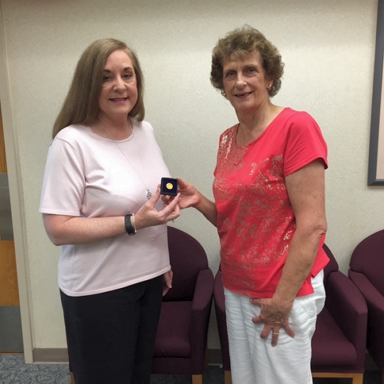 Leonardtown Rotary President Barbara Thompson (right) presents Ms. Wray with her Paul Harris +7 pin.