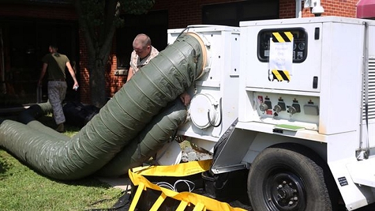 Marines with engineer platoon, Chemical Biological Incident Response Force set up a mobile air-conditioning unit at the local chow hall aboard Naval Support Facility Indian Head, Maryland, July 22, 2016. Providing air-conditioning to the chow hall gave the Marines hands-on training that further sharpens their skills needed to conduct expeditionary operations. (USMC Photo)