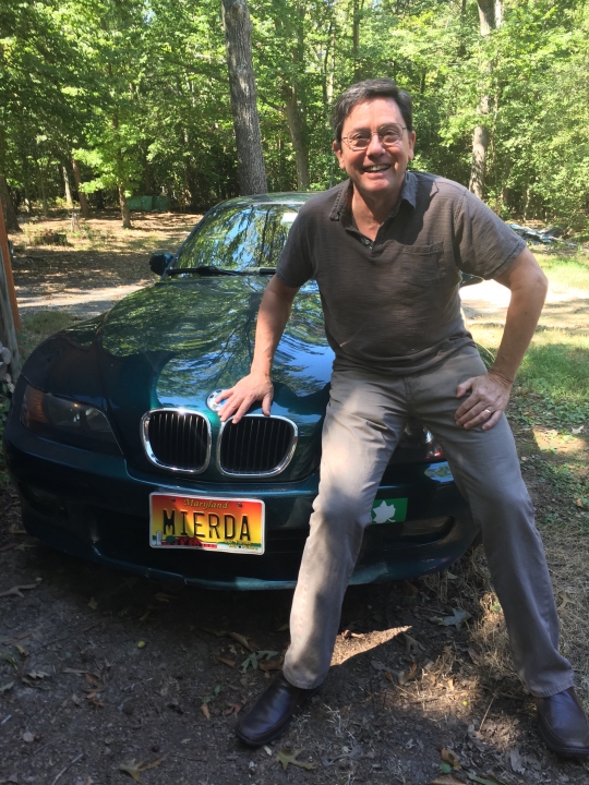 John T. Mitchell poses with his car's "MIERDA" license plate, which the Maryland Motor Vehicle Administration recalled in 2011. The plate is the subject of a case in the Maryland Court of Appeals. Sept. 14, 2016. (Courtesy photo from John T. Mitchell.)