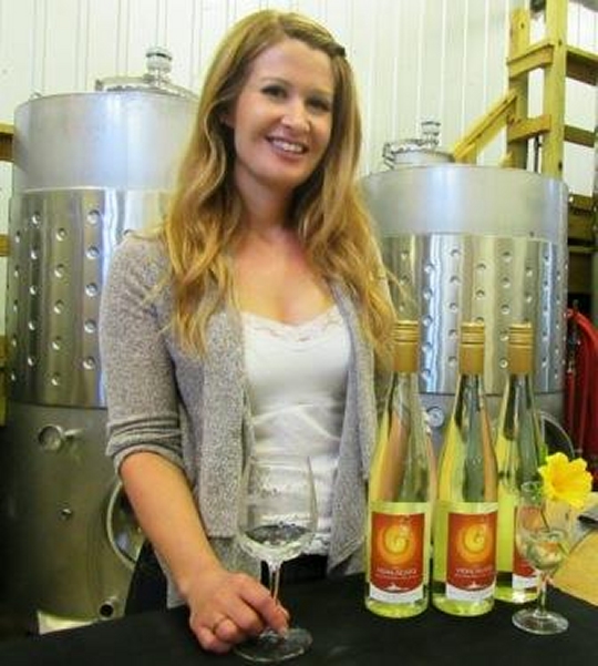 Lauren Zimmerman, the new chief winemaker, poses with Vidalacato, her first release. (photo: Port of Leonardtown web site)