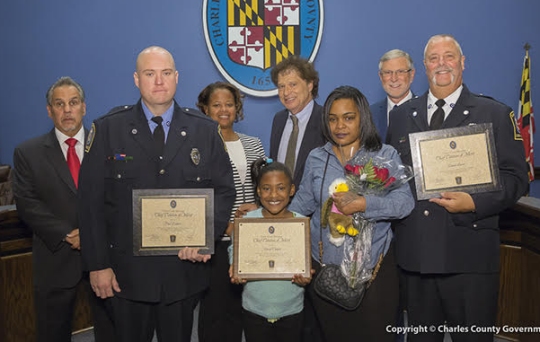 The Commissioners with Paul Lenharr, Department of Emergency Services; A'Nasia Clayton; Jan&eacute;e Clayton; and Ronald Lucas, Department of Emergency Services. Not pictured: Robert Steinen, Department of Emergency Services.