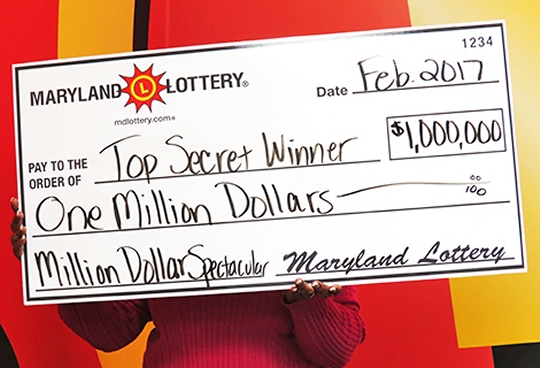 This "Top Secret Winner" from Charles County plans to purchase a new home after winning $1 million playing the Million Dollar Spectacular scratch-off game. (Photo courtesy of Md. Lottery)