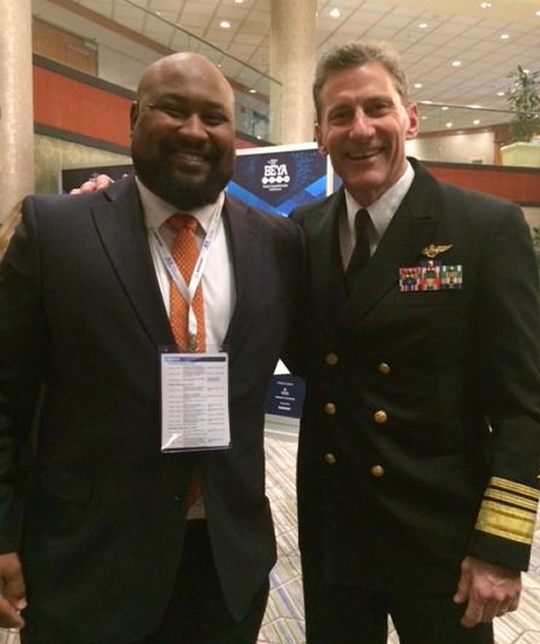 Kwamé Marshall, left, an electrical engineer at Naval Air Warfare Center Aircraft Division, Patuxent River, celebrates his win as a Most Promising Engineer-Government at the 31st annual Black Engineer of the Year Award Conference in Washington, D.C., with NAVAIR Cmdr. Vice Adm. Paul Grosklags. (USN photo)