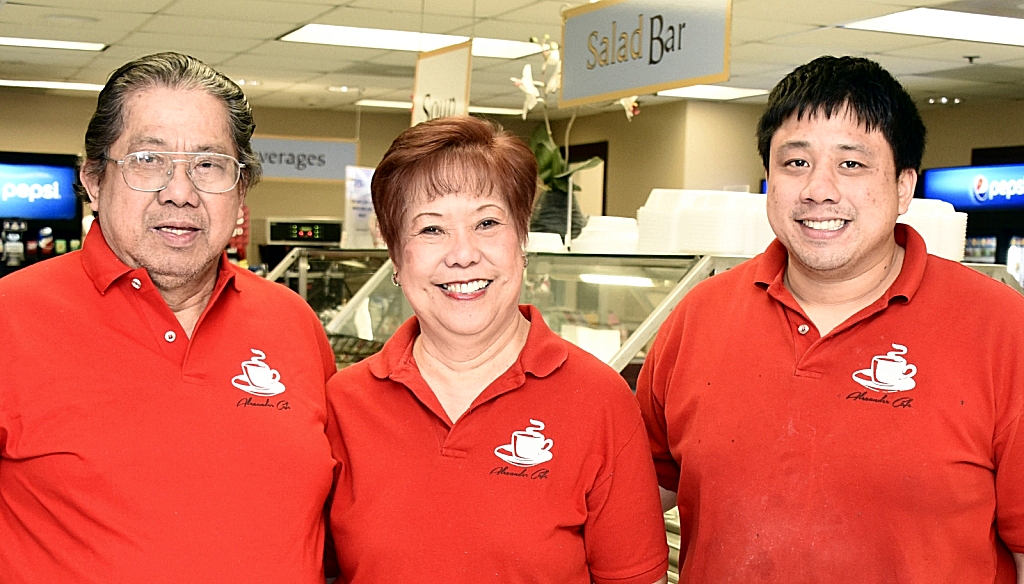 From left, Jun and Corazon Dones are the much-loved contractors who operate the College of Southern Maryland cafeteria at the La Plata Campus and handle most of the college's catering jobs. The couple's son, Alex, right, is in training to take over the business from the busy couple. The Doneses also have four other adult children.