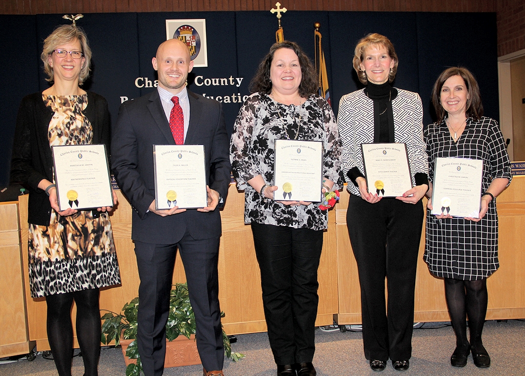 The Board of Education honors Charles County Public Schools students and employees during monthly meetings at special recognition ceremonies. At its March 21 meeting, the Board honored five employees for their commitment to teaching and learning. Honored, from left, were Anastasia Griffin, a mathematics teacher at North Point High School; Tyler Miller, a physical education teacher at Mattawoman Middle School; Yvonne Haws, a kindergarten instructional assistant at Mary B. Neal Elementary School; Mary Montgomery, a fifth-grade teacher at Walter J. Mitchell Elementary School; and Christina Caron, a learning resource teacher at Mary H. Matula Elementary School.
