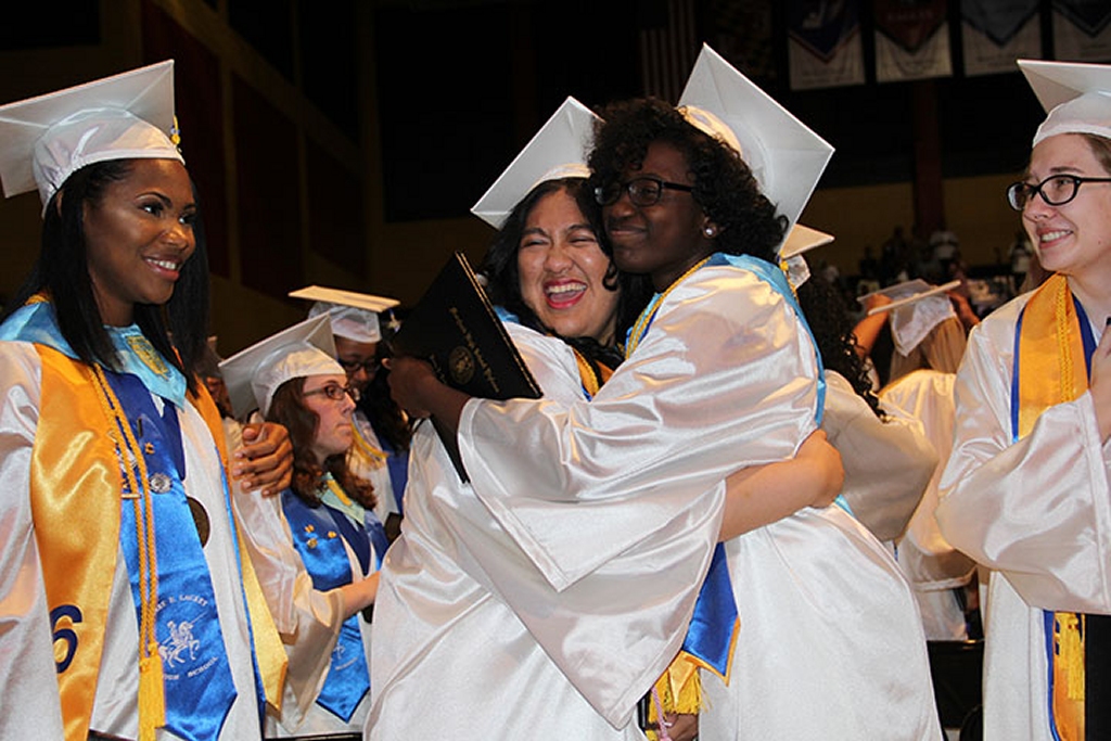  Henry E. Lackey High School graduates Victoria Martin, left, Franchezka Matundan, Venishea Smith and Brittany Culbreth celebrate at the conclusion of commencement exercises on June 3. (Photo: CCPS)