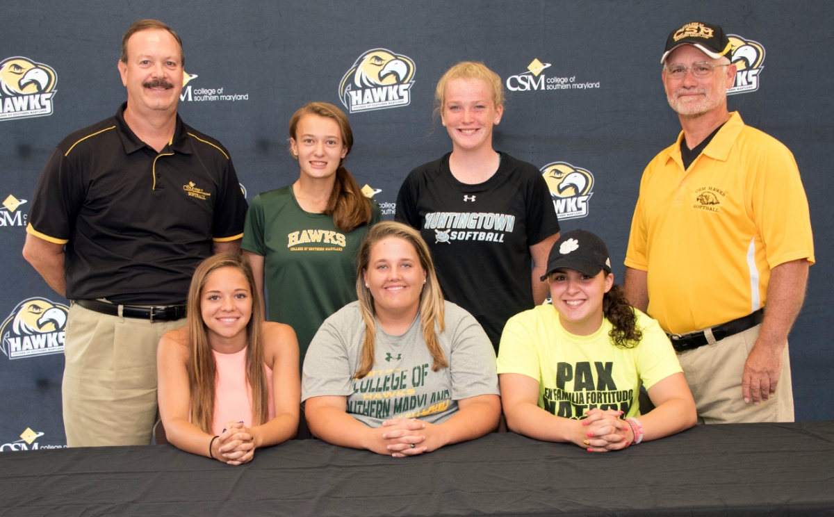 Newly signed women's softball players are, seated from left, Lindsey Wood, Michaela Guy, Haylee McClanahan and, standing, second from left, Alyssa Case and Kailey Cannon. Assistant Coach Bill Hitte is in back, left, and Head Coach Jim Cleary, right.