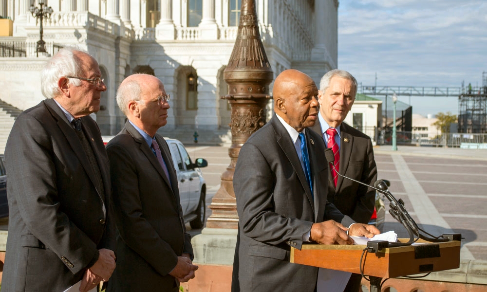 WASHINGTON--Sen. Bernie Sanders, I-Vermont, Rep. Peter Welch, D-Vermont, Rep. Elijah Cummings, D-Maryland, and Rep. Lloyd Doggett, D-Texas, (L-R) unveil the Medicare Drug Price Negotiation Act in a joint press conference at the United States Capitol on October 25. (Photo by Helen Parshall)