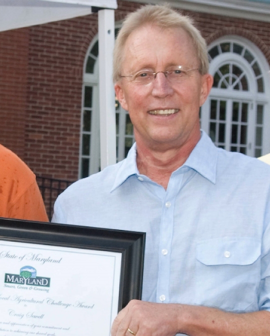 Craig Sewell receives the The Smart Green and Growing Governor's Excellence in Supporting Maryland Farmer's and Agriculture Award at the Maryland Department of Agriculture Buy Local Cookout in 2011.
