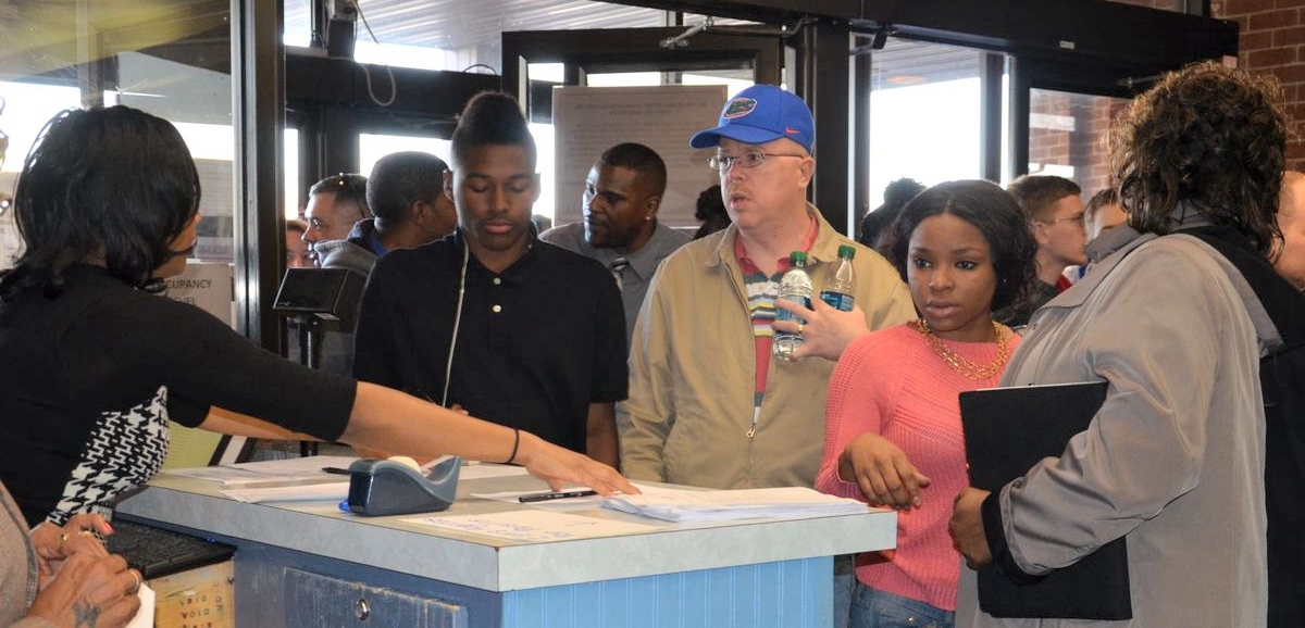 Teens and parents check in at Center Stage Theater to attend the Child Youth Programs' Career Launch orientation in 2014. Now in its 11th year, the program helps teens build much-needed work skills. (U.S. Navy photo by Donna Cipolloni)