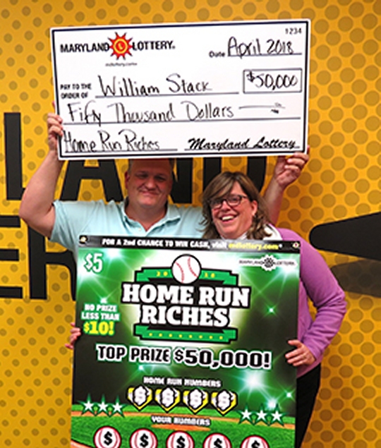 Bill and Kim Stack of Lusby celebrate his $50,000 Home Run Riches scratch-off win.