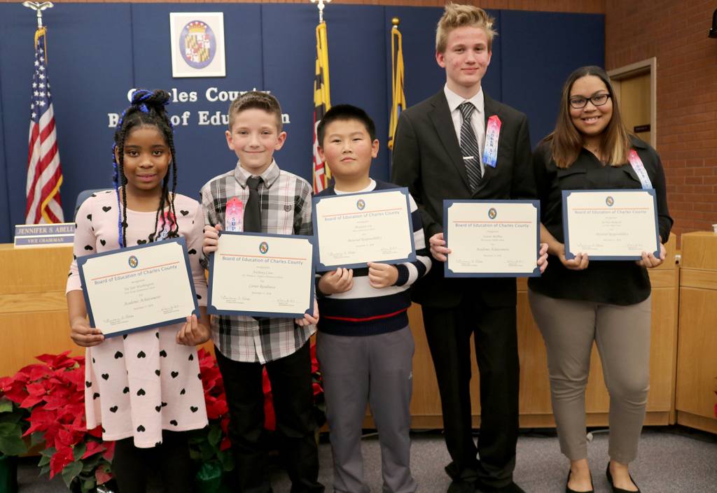 The Board of Education at its Dec. 11 meeting honored five Charles County Public Schools (CCPS) students for exemplary accomplishments in the area of academic achievement, career readiness and personal responsibility. Honored, from left, were Tre'Joir Washington, third-grade student at Eva Turner Elementary School; Anthony Cave, fifth-grade student at Dr. Thomas L. Higdon Elementary School; Brandon Lin, fifth-grade student at Berry Elementary School; Steven McPhee, eighth-grade student at Piccowaxen Middle School; and Ja'Nae Pickeral, a senior at La Plata High School.