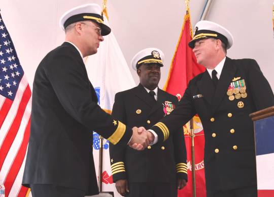 DAHLGREN, Va. (April 24, 2019) --- Capt. (sel) Stephen 'Casey' Plew, right, commanding officer of the Naval Surface Warfare Center Dahlgren Division (NSWCDD), shakes hands with Rear. Adm. Eric Ver Hage, commander of the Naval Sea Systems Command (NAVSEA) Warfare Centers, moments after formally assuming command of NSWCDD during a change of command ceremony. Looking on is Capt. Godfrey 'Gus' Weekes, outgoing NSWCDD commanding officer. (U.S. Navy photo by John Joyce/Released)