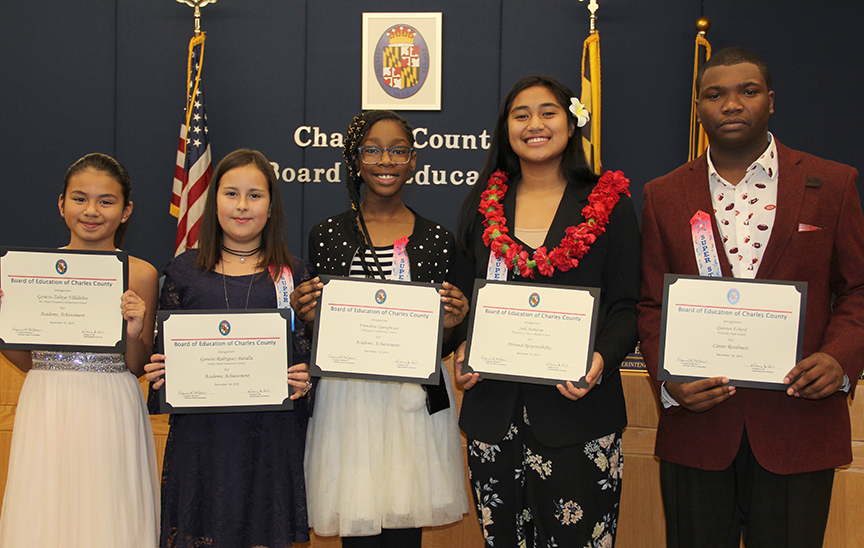 The Board of Education at its Dec. 10 meeting honored five Charles County Public Schools (CCPS) students for accomplishments in the areas of academic achievement, career readiness and personal responsibility. Honored, from left, were Genesis Zelaya Villalobos, a fifth grader at Mt. Hope/Nanjemoy Elementary School; Genesis Rodriguez Batalla, a fifth grader at Indian Head Elementary School; Emmaline Ogungbesan, a fifth grader at Billingsley Elementary School; Suki Aumavae, an eighth grader at Theodore G. Davis Middle School; and Westlake High School senior Quinten Echard.