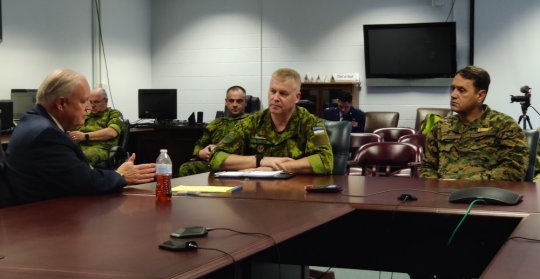 Russell Strickland, Maryland's acting secretary of emergency management (left), meets Thursday at Camp Fretterd Military Reservation with Brig. Gen. Riho &Uuml;htegi, commander of the Estonian Defense League (middle) and Lt. Gen. Senad Ma&scaron;ovic, the chief of defense for the Armed Forces of Bosnia-Herzegovina. (Photo: Ryan White)