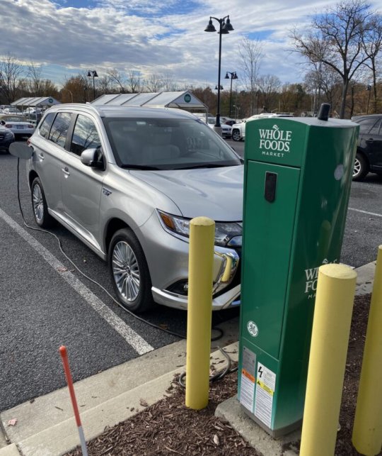 RIVERDALE, Md. --- Maryland is using state and federal money to expand the network of electric vehicle charging stations in the state. This is an electric charging station in the parking lot of the Whole Foods Market here. (James R. Carroll)